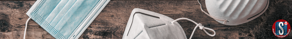 Disposable and N95-style dust masks laid out on a wooden surface, representing Skookum Tools’ Zenith disposable mask category for breathing protection in dusty or low-exposure environments.